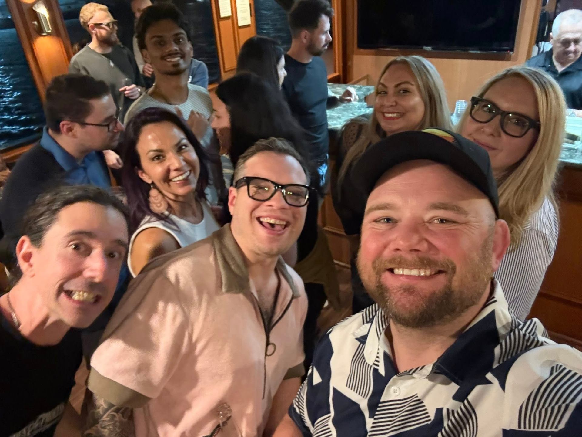 Attendees connecting on the yacht at night