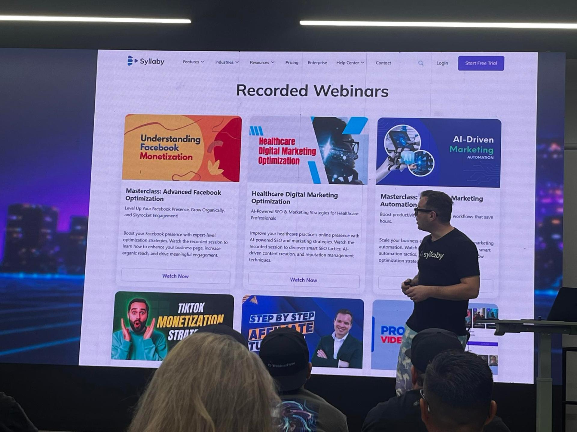 Austin Armstrong presenting on stage